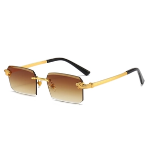 Luxury rimless sunglasses with leopard head metal accent and brown gradient lenses