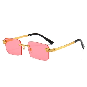 Frameless rectangle sunglasses with pink lenses and gold dragon-carved metal temples