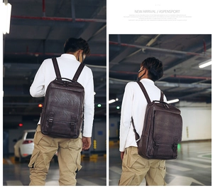 Detail view of a vintage dark brown PU leather backpack on a male model in a city garage