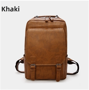 Detail view of khaki PU leather backpack with vintage buckles and functional front pockets