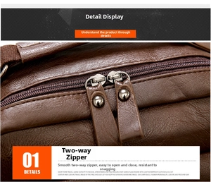 Close-up of smooth two-way metal zippers on a premium brown PU leather backpack