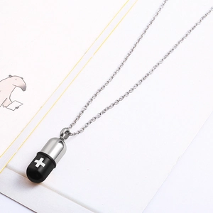 Minimalist silver and black pill capsule necklace pendant on a fine silver chain