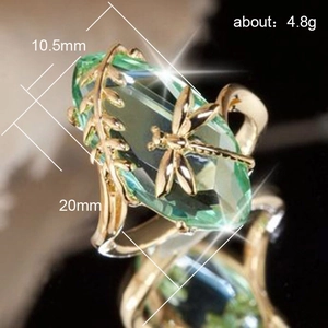Gold dragonfly ring featuring olive green gemstone with 10.5mm size and leaf design
