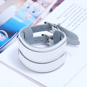Detail view of the white punk leather wide bracelet with double silver buckles