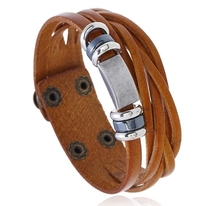 Braided brown leather bracelet for men with vintage silver accents on white background