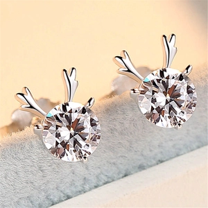 Macro shot of silver reindeer antler stud earrings with sparkling cubic zirconia stones