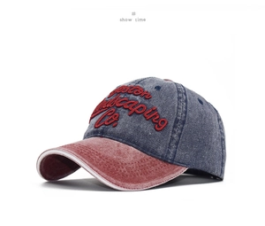 Detail of 3D embroidered Boston Landscaping Co. text on vintage washed denim baseball cap
