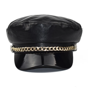 Chic black PU leather baker boy hat with glossy visor and gold chain decoration
