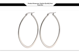 Detail shot of silver oval hoop earrings with a polished finish and drop design