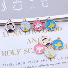 Macro shot of Snoopy and Charlie Brown enamel charms for DIY jewelry accessories