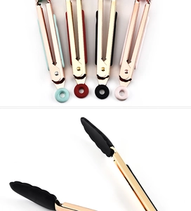 Close-up of multicolored silicone food tongs with elegant gold-plated metal arms
