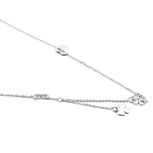 Silver necklace featuring heart, infinity symbol, and four-leaf clover charms on white background