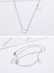 Detail of silver titanium steel cross pendant necklace with lobster clasp and extension chain