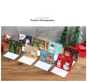 Detailed view of 3D Christmas pop-up greeting cards with cartoon reindeer and snowman