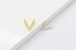 Close-up of V-shaped S925 silver pendants with zircon stones in gold and silver finish