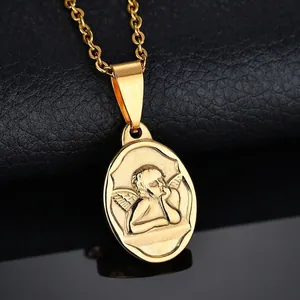 Gold stainless steel cherub angel pendant necklace on black reflective background