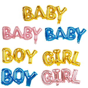 Close-up of baby party foil balloons in gold, pink and blue showing material detail