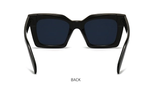 Detailed back view of vintage PC sunglasses with thick black frames and metal rivet accents