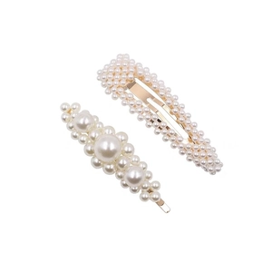 Elegant gold pearl hair clip set featuring rectangular and floral faux pearl hairpins