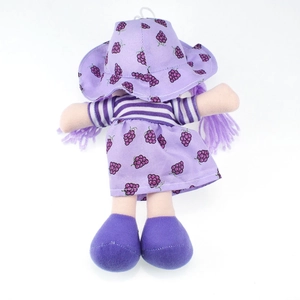 Back view of purple fruit doll with grape print dress, hat, and yarn braids