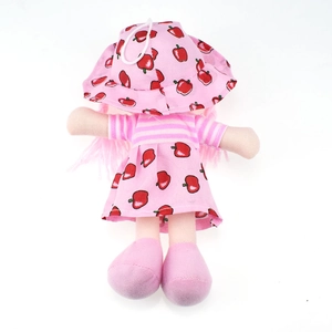Back view of cute plush doll in pink fruit dress and apple print sun hat for girls