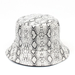 Close-up of the detailed black and white snakeskin pattern on the trendy bucket hat