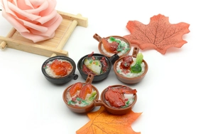 Macro view of six diverse miniature Chinese food models in tiny ceramic-style pots