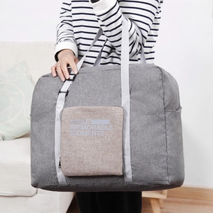 Gray waterproof travel toiletry bag with hanging hook and beige pocket detail