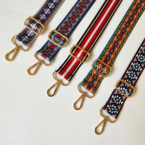 Close-up of five adjustable ethnic and bohemian style bag straps with gold metal hooks
