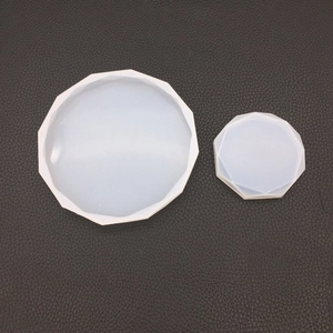 Macro detail of two round faceted gemstone silicone molds for DIY resin and plaster casting
