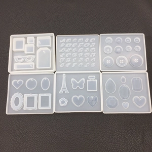 Flat lay of 6-piece DIY silicone mold set for resin pendants and 3D letters