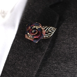 Retro multi-color rose suit brooch with golden leaf on grey wool blazer lapel