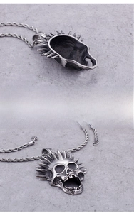 Detailed side and front view of a punk rock skull pendant with a twisted rope chain necklace