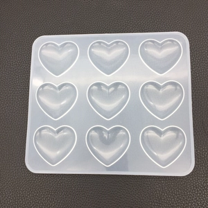 Macro shot of 9-cavity heart silicone mold for DIY resin and plaster crafts