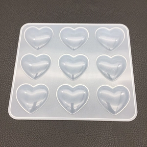 Top view of a 9-cavity heart shaped silicone mold for resin casting and DIY crafts