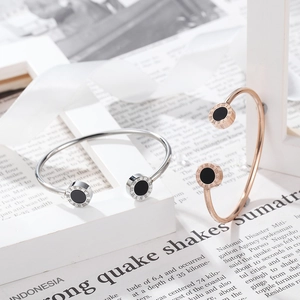 Roman numeral stainless steel cuff bracelet with onyx-style inlay in rose gold and silver
