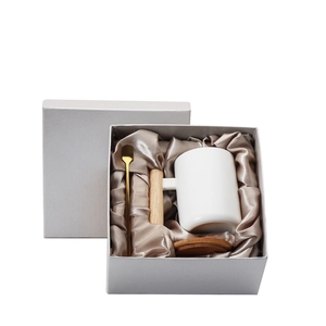 Ceramic mug with wooden handle, lid, and golden spoon in a premium silk-lined gift box