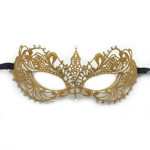 Golden lace masquerade mask with white rhinestones and black satin ribbons on white background