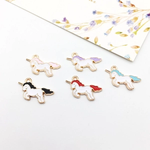 Enamel unicorn charms in five colors for DIY jewelry making on white background
