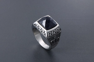 Close-up of vintage silver titanium ring featuring a square blue goldstone inlay