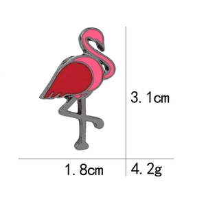 Detailed view of enamel flamingo pin with dimensions 3.1cm x 1.8cm and 4.2g weight
