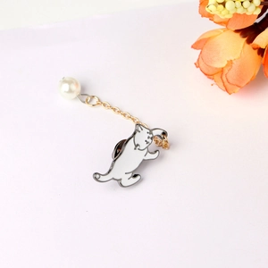 Cute white enamel cat brooch with golden chain and pearl accent on a minimalist background