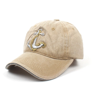 Detail of nautical anchor embroidery on washed cotton khaki baseball cap