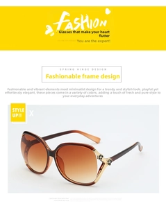 Detail of polarized sunglasses with golden camellia flower accent and spring hinge