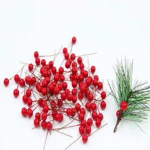Artificial red berries with pine needles for DIY Christmas wreaths and holiday decoration