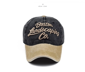Close-up of 3D embroidered Boston Landscaping Co text on washed cotton baseball cap