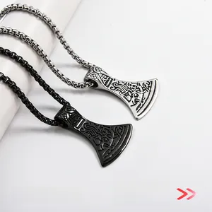 Detailed view of Viking axe pendants in silver and black finish with Nordic relief