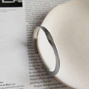 Minimalist S925 sterling silver open twist cuff bracelet with matte finish by white ceramic