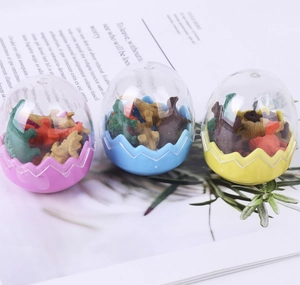 Three-pack dinosaur egg erasers in pink, blue, and yellow colors for students