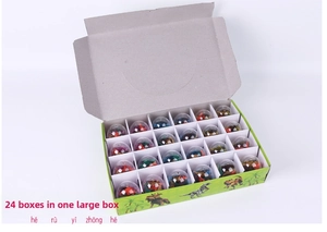 Detailed view of 24 pieces dinosaur egg erasers set in a colorful cartoon display box